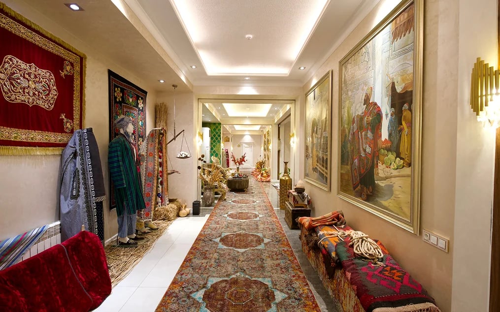 Silk Road Empire hotel corridor with carpets and paintings